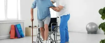 Physiotherapist at Physio Experts helping a patient with neurological rehabilitation and mobility training.